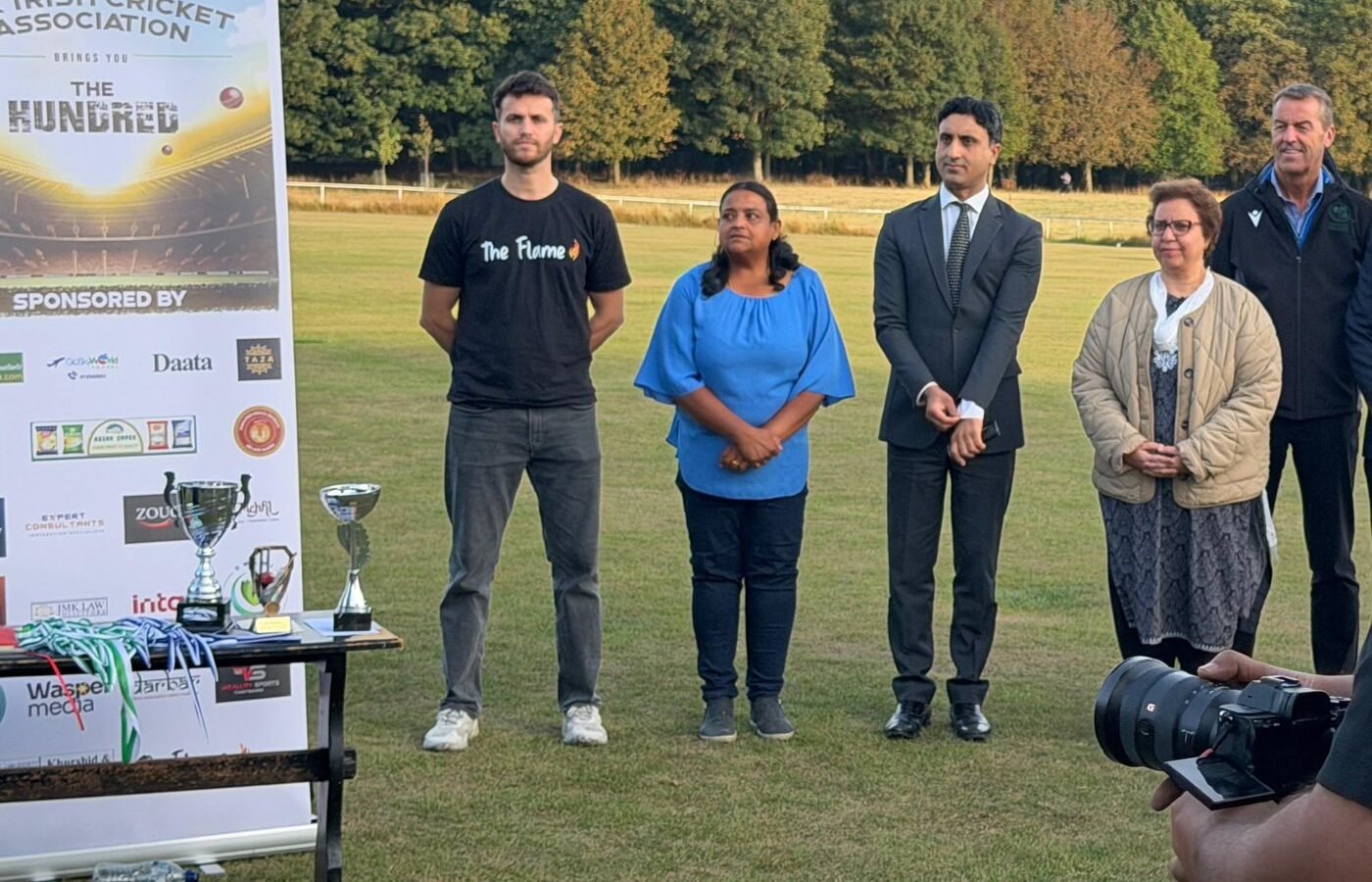 The Flame at the Irish Cricket Association's The Hundred match, with the trophies on the table